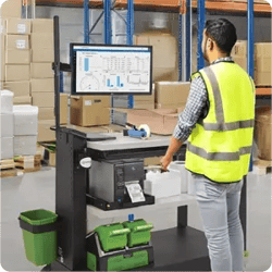 A warehouse worker using a mobile workstation