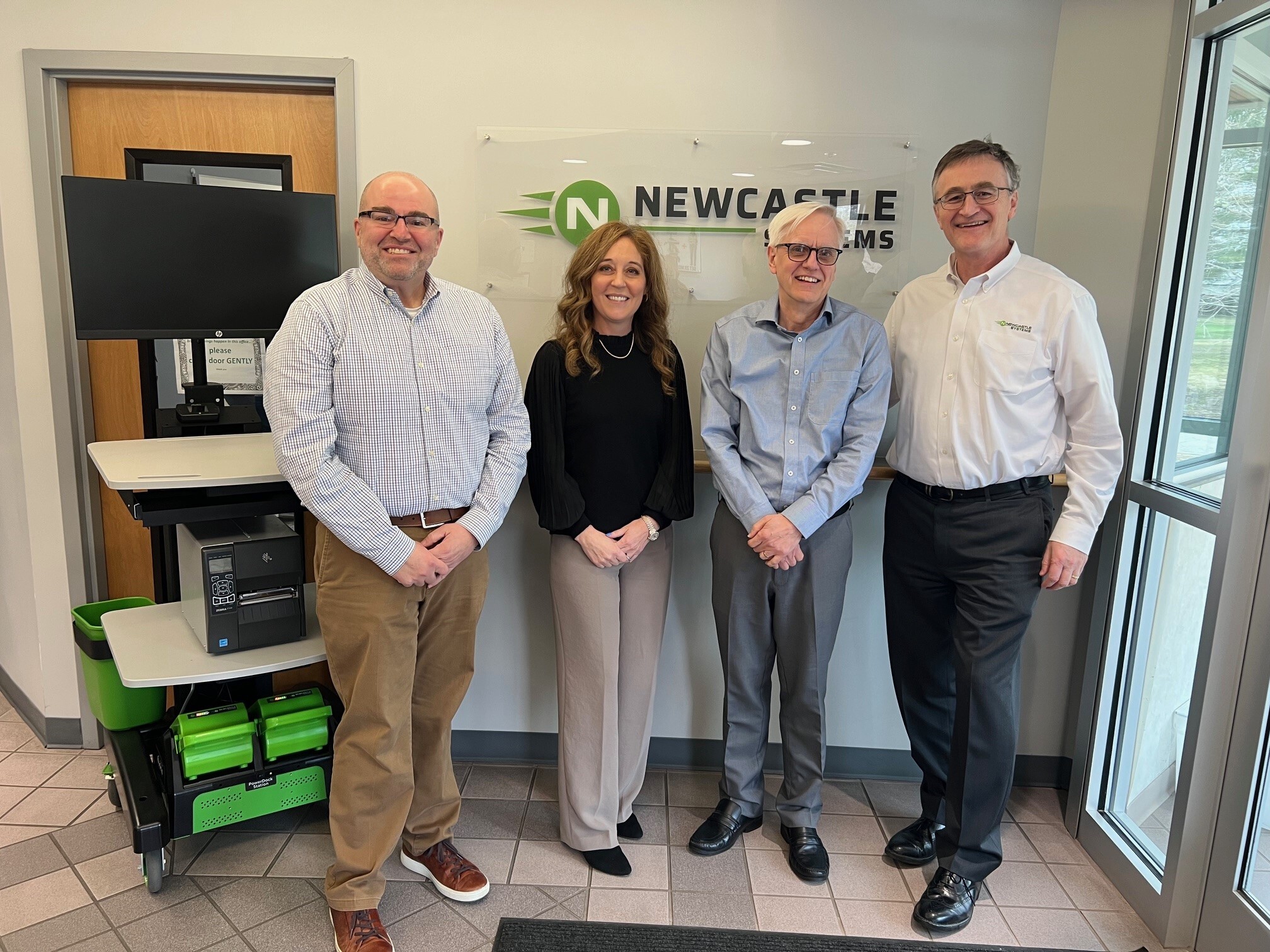 John O'Kelly with leaders from TouchPoint, Inc. at Newcastle Systems in Amesbury, Massachusetts