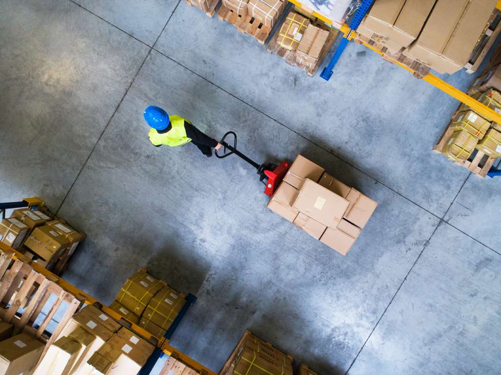 Warehouse worker pulling a pallet