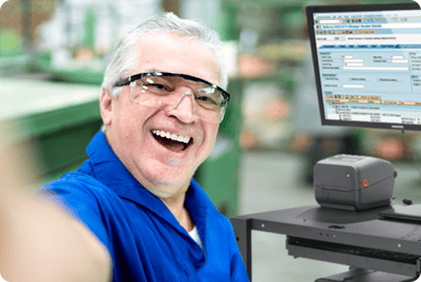 Man taking selfie next to workstation