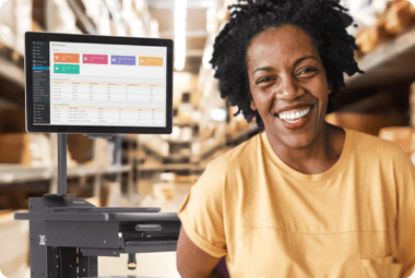 Lady smiling next to workstation
