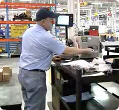 A warehouse worker using a mobile warehouse receiver