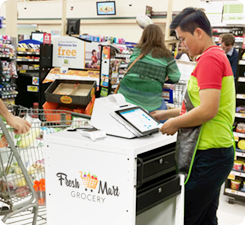 Retail worker assisting a customer at checkout