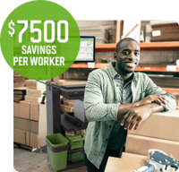 A warehouse worker smiling while working at a packing station equipped with a mobile workstation.