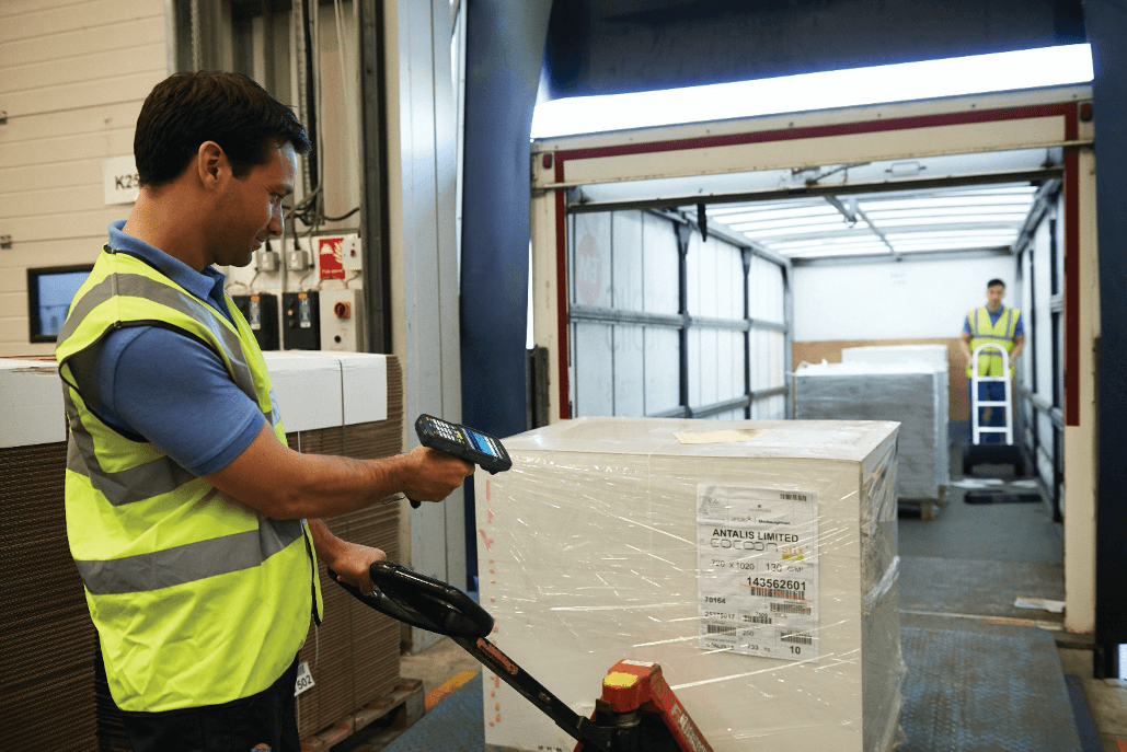warehouse-worker-scanning-pulling-crate