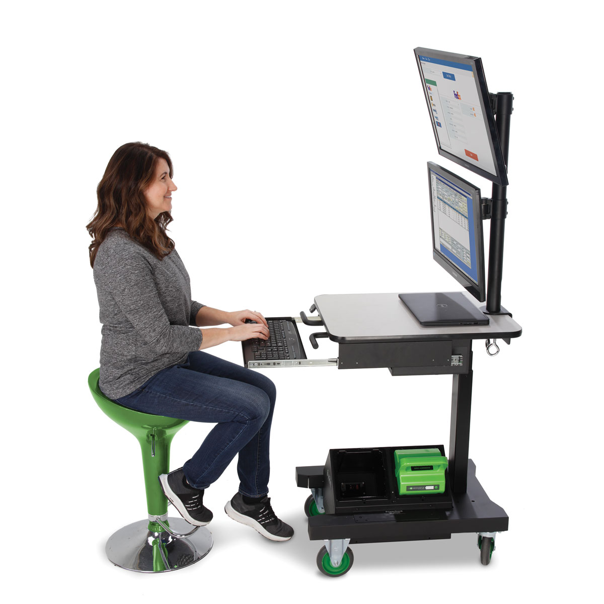 Manufacturing technician sitting while using Ergonomic Industrial Computer Cart