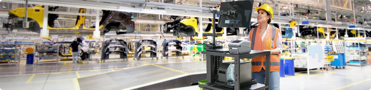 Manufacturing worker interacting with mobile workstation